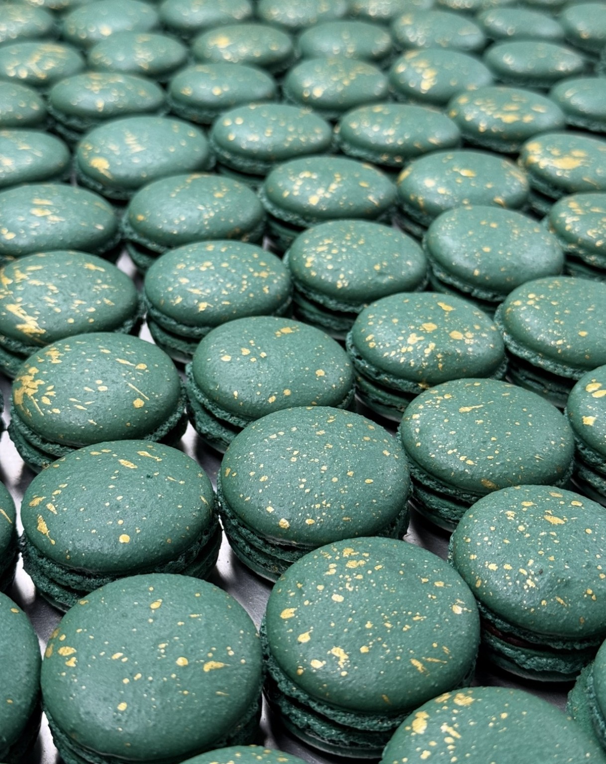 Teal macarons with gold detail